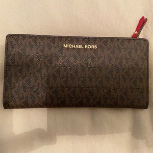 Red and brown Michael Kors snap wallet with removable card holder
